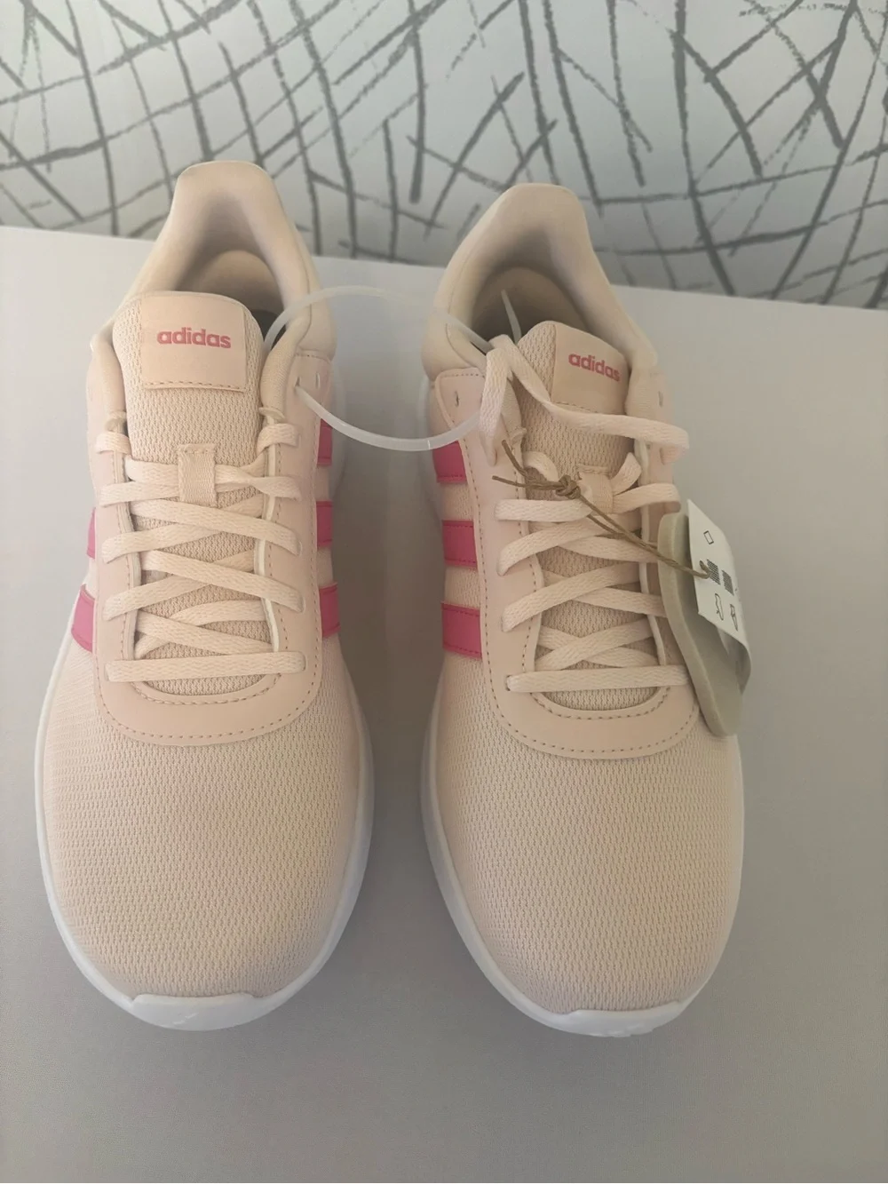 Adidas Lite Racer 4.0 sneakers  pink and a lightweight design. JR8539